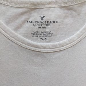 White Cotton American Eagle tank top with ruffles